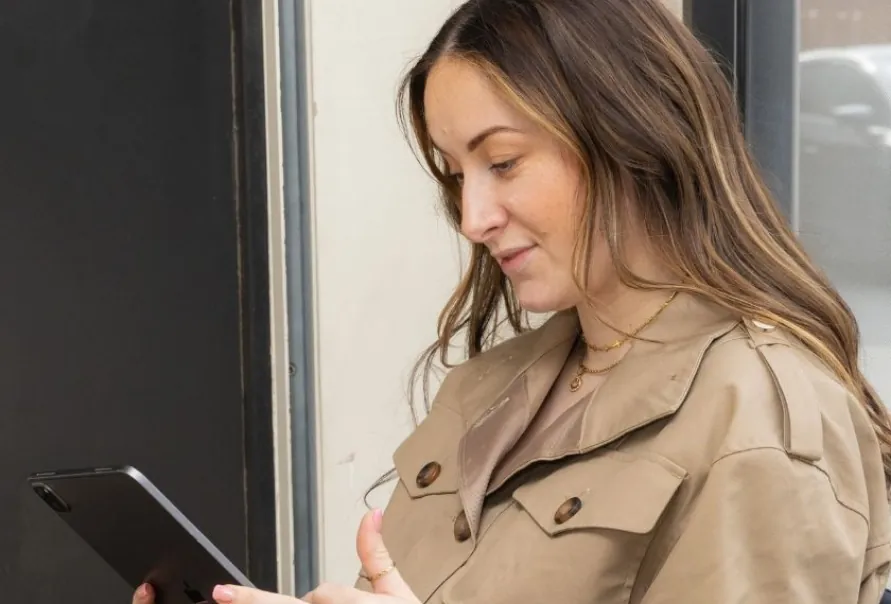 A patient using a tablet during a visit to Nu Dentalign